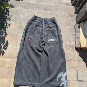 Rare Dragon Jncos - Rare black jncos with dragon print on leg and silver "jncos" logo on right back pocket. There are only a few pairs of these known to exist. 27 Waist Condition: very good condition, only thing is that the button is missing