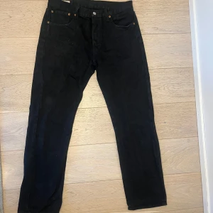 Levis 501 - Have been used a bit, and the color has faded just a little, but not that much that it could be seen straight away. The style is straight leg.  W33/L30