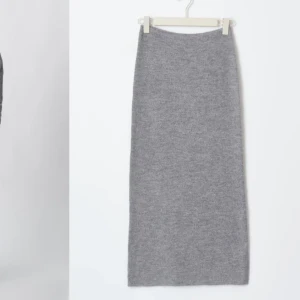Grå Stickad kjol - Oanvänd grå stickad kjol i storlek M men lite stor i storleken så passar även en L. Kjolen är 96 cm lång