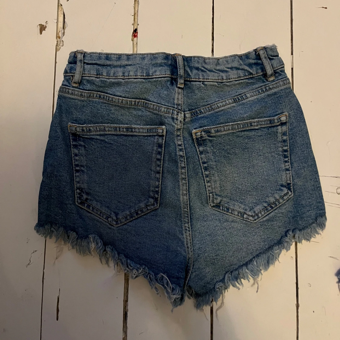 Blå jeansshorts med fransar - 1
