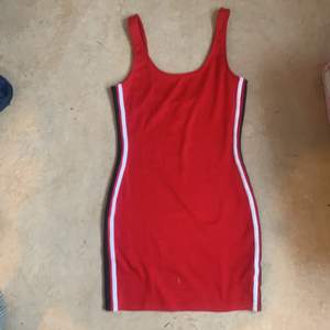 Red mini dress.Size 34.Black amd white stripes on the sides. 