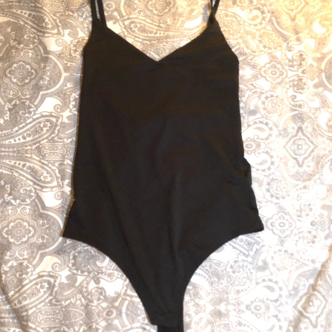 Svart body. Storlek L