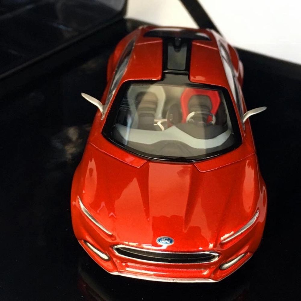2012 Ford Evos model vehicle prepared by Ford for collectors. Ford Evos, shown as one of the car concepts of the future, is a hybrid concept with a mixture of gasoline engine, electric motor and lithium-ion battery. Designed by Stefan Lamm, led by Ford Europe design director Martin Smith. 1:43 scale model car in original special box. You can register the product by scanning the QR code on the back of the box with your mobile phone. The product is produced by Cybergroup, which produces model vehicles and promotional products of many world brands. There is no problem or deformation in the product. It has never been taken out of its box. Scale: 1:43 (10.5 x 4,5 x 3 cm) Manufacturer: Norev France Model year: 2012 Colour: Red Hot Chilli Item number: 003215369FDD73BF Weight: 400 gr Box Scale: 17x16x8 cm. Övrigt.