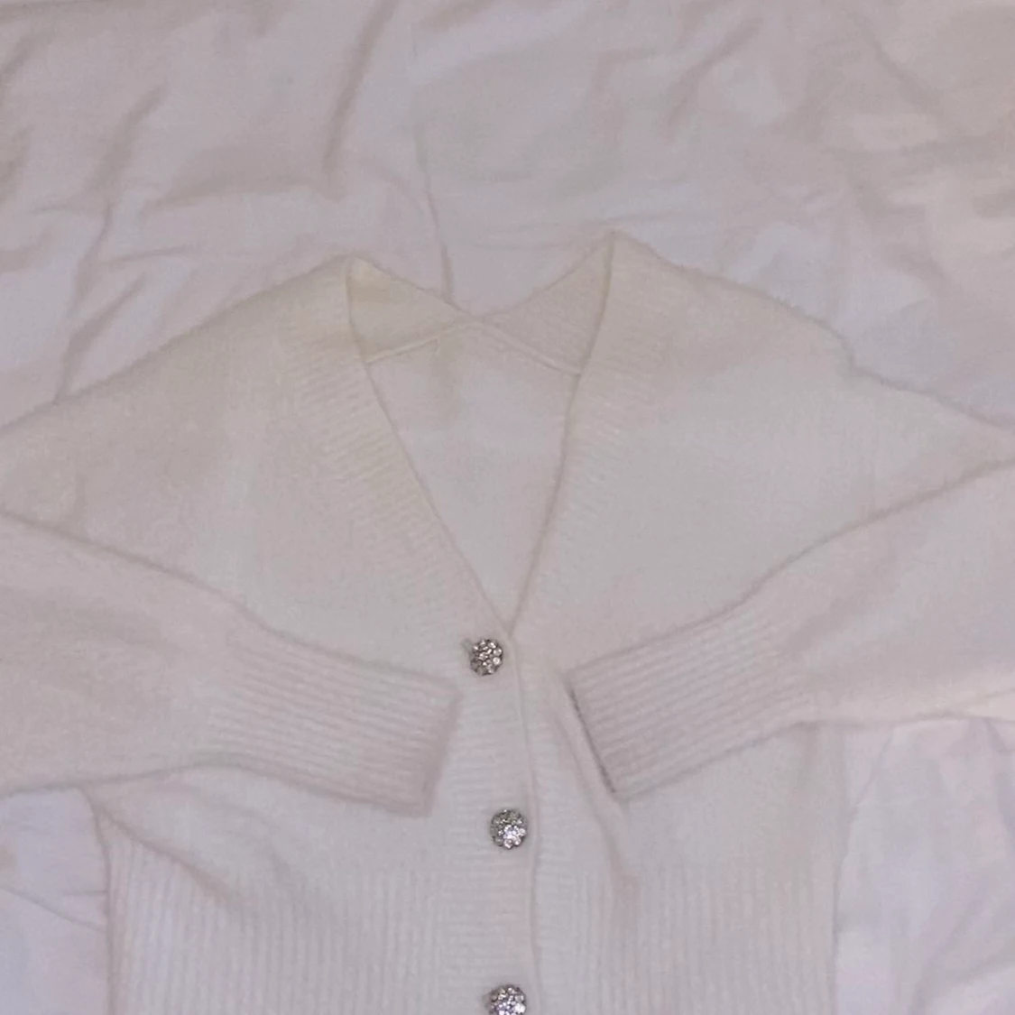 Mjuk kofta med diamantknappr