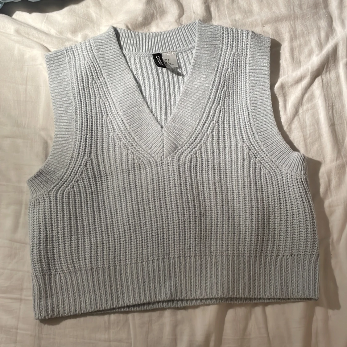 Ljusblå stickad väst