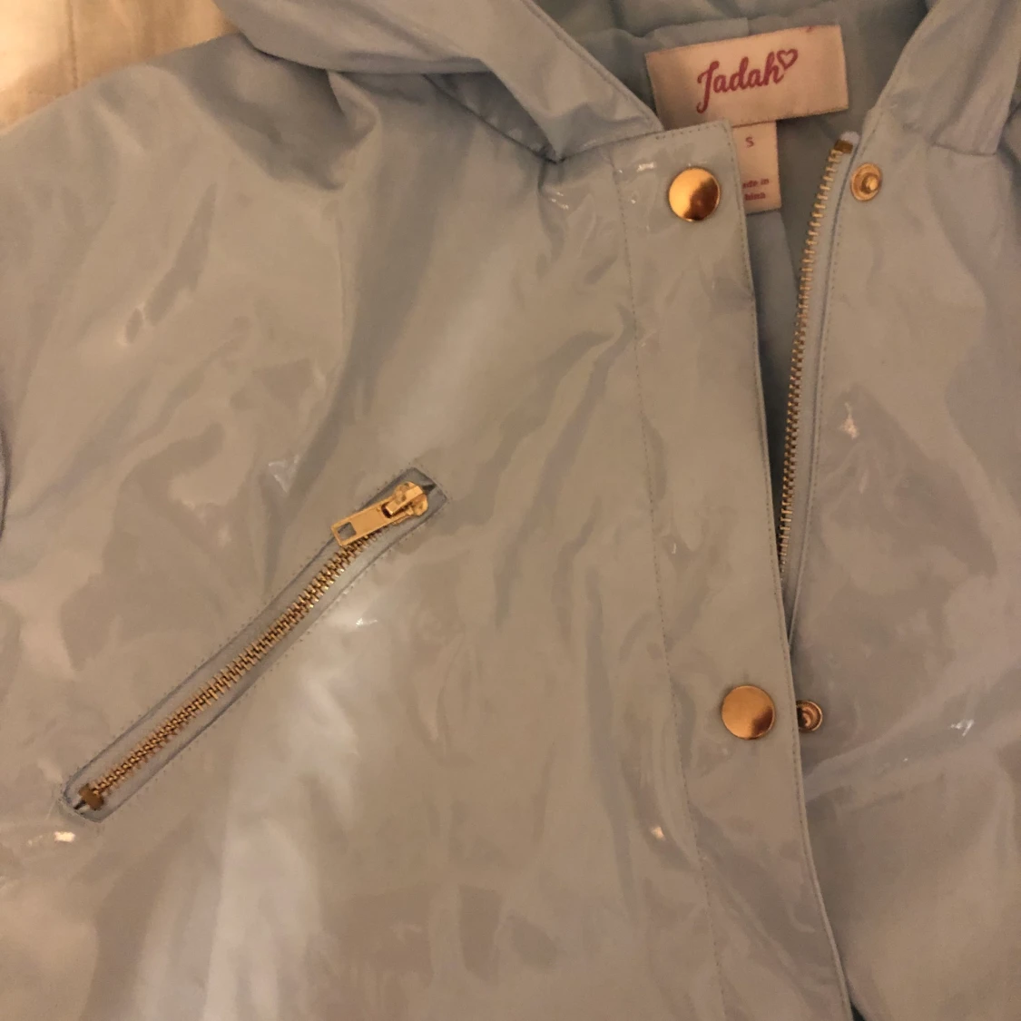 Ljusblå regnjacka - 91