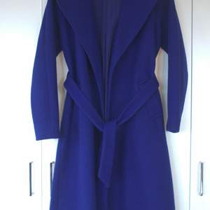 Long blue coat (approx. 108cm long) from BIK BOK in XS. The coat was used only a few times and it is in a very good state.