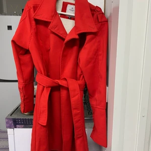 Orange color coat, bust size 96 - Female coat with belt. Condition: used (like new). Going to sell because it does not fit me now