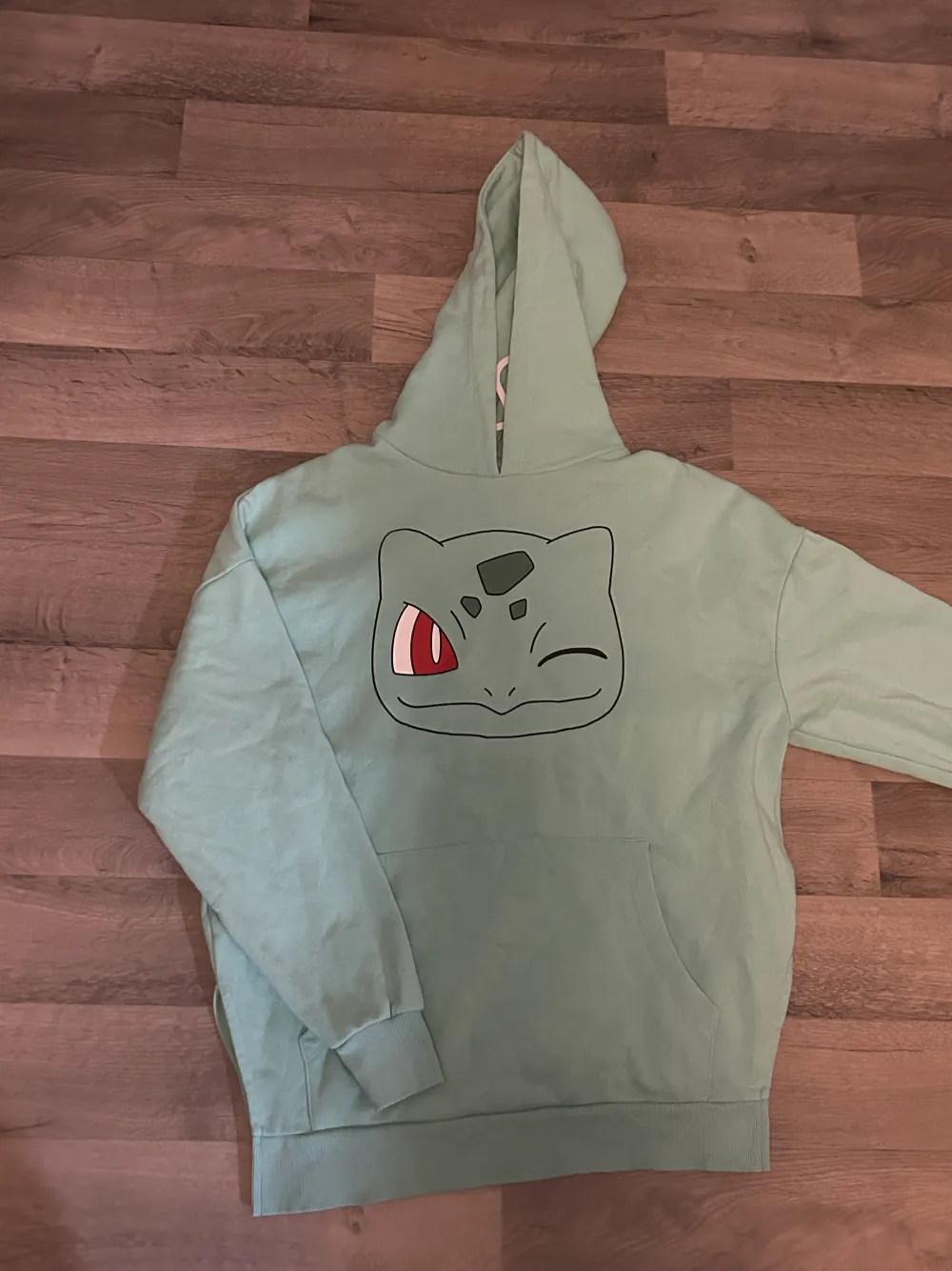 Green pokemon oversize hoodie, actual size s/xs but it fits on M just as good. Worn only a few times and very warm. Hoodies.