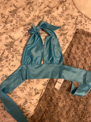 Topp - Superfin blå topp från Gina, inte använd.