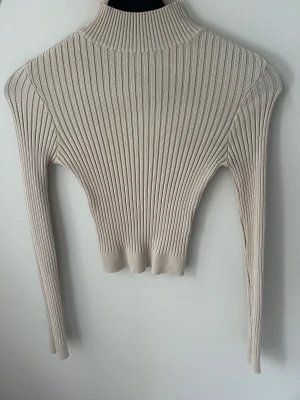 Stickad tröja  - Beige