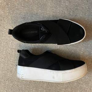 Black paltform slip-in sneakers used a few times only. 