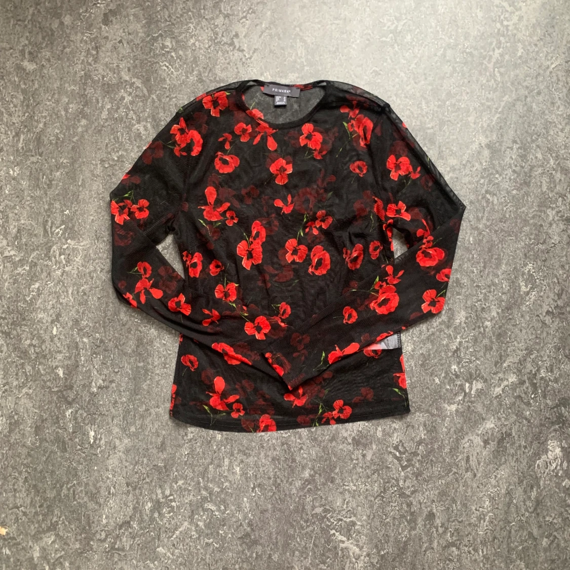 Blommig meshtopp storlek 42