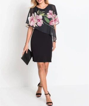Cocktailklänning  - En svart klänning med blommig ”poncho ”. Använd bara en gång. 