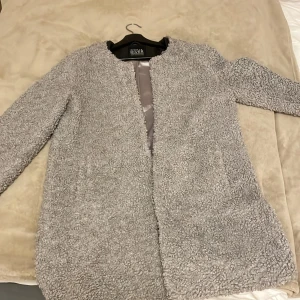 Jacket - Soul river jacket in light grey witha teddy fur. Fits size M. In good condition looks classy.