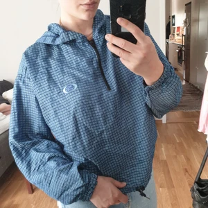 True Vintage Windbreaker - A gorgeous vintage blue plaid windbreaker with hood. Oversized fit, thrifted in USA