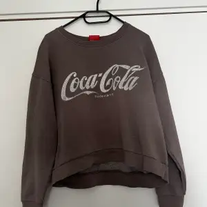 Retroversion av Coca cola sweather Stl S