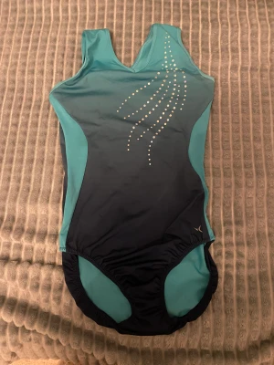 Gymnastikdräkt  - Nästan helt oanvänd gymnastikdräkt som är svin stretchig. Storleken kan vara allt från typ 158-M. 