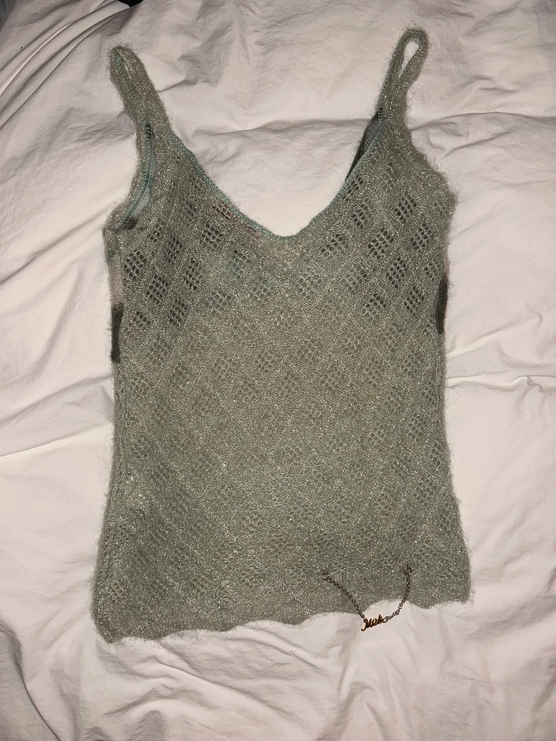 Glittrig stickad topp - 90