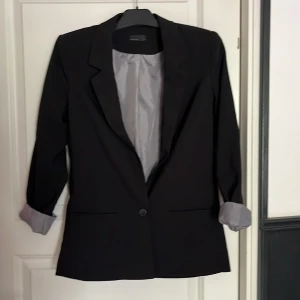 Kavaj - Jättesnygg retrokavaj. Fint skick. Axelvaddar. 