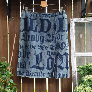 Vintage Moschino Skirt - Vintage Jeans Skirt by Moschino Jeans Rare piece, featuring a medieval print  Details - Slit, hidden zipper closure on side  Size: Depending on where you wear it on the hip/waist - size XS for a low waist, size S for mid and size M for a high waist look.
