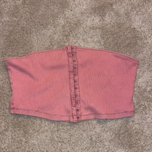 Topp/waistshirt - Rosa waistshirt som kan användas som topp eller på annan tröja/skjorta! Använd fåtal gånger