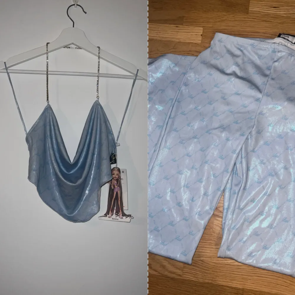 Helt nytt sett från bershka från deras Bad gyal kollektion, ett extremt snyggt ljusblått glansigt sett med texten Bad på tyget och guld/kristall detaljer i Storlek M,inte ens testat prislapp finns kvar på plagget, byxorna har även utsvängda ben längst ned. Toppar.