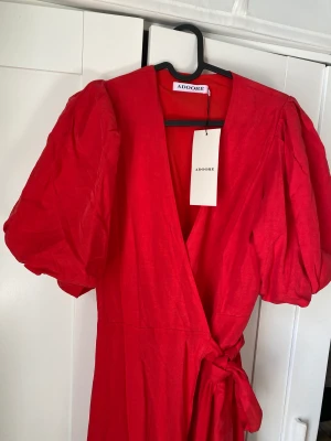 Adoore red dress  - Adoore beautiful red dress, bought it first year Adoore was open is not any longer online in this color I think. New with tags still on 