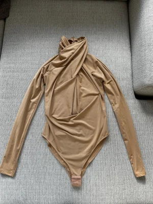 Body - Body från h&m som är använd endast en gång. 