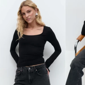 Svart soft touch jersey topp - Tunn svart uringad tröja från Gina med slits på ärmarna, priset kan diskuteras!
