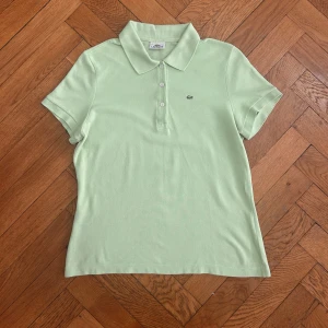 Vintage Lacoste light green polo, 44 (L) - Vintage Lacoste light green polo                               Size 44 (L)                                                  Measurements:                                                    Shoulders 38cm                                                       Sleeves 18cm                                                          Armpits 50cm                                                            Length 58cm 