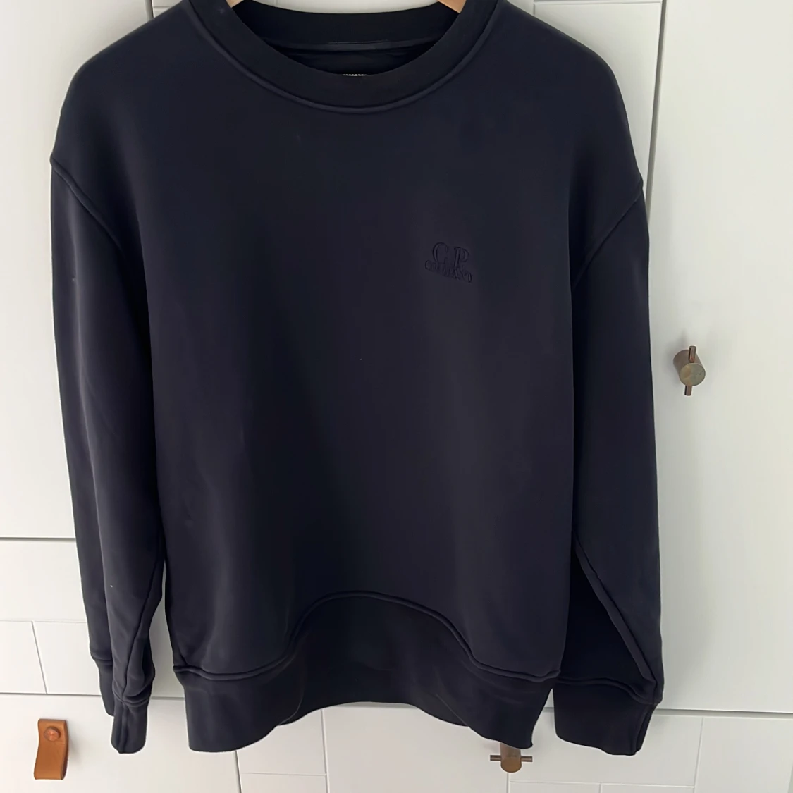 Mörkblå sweatshirt från C.P. Company