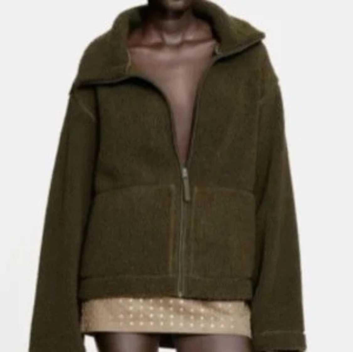 Olivgrön teddyjacka