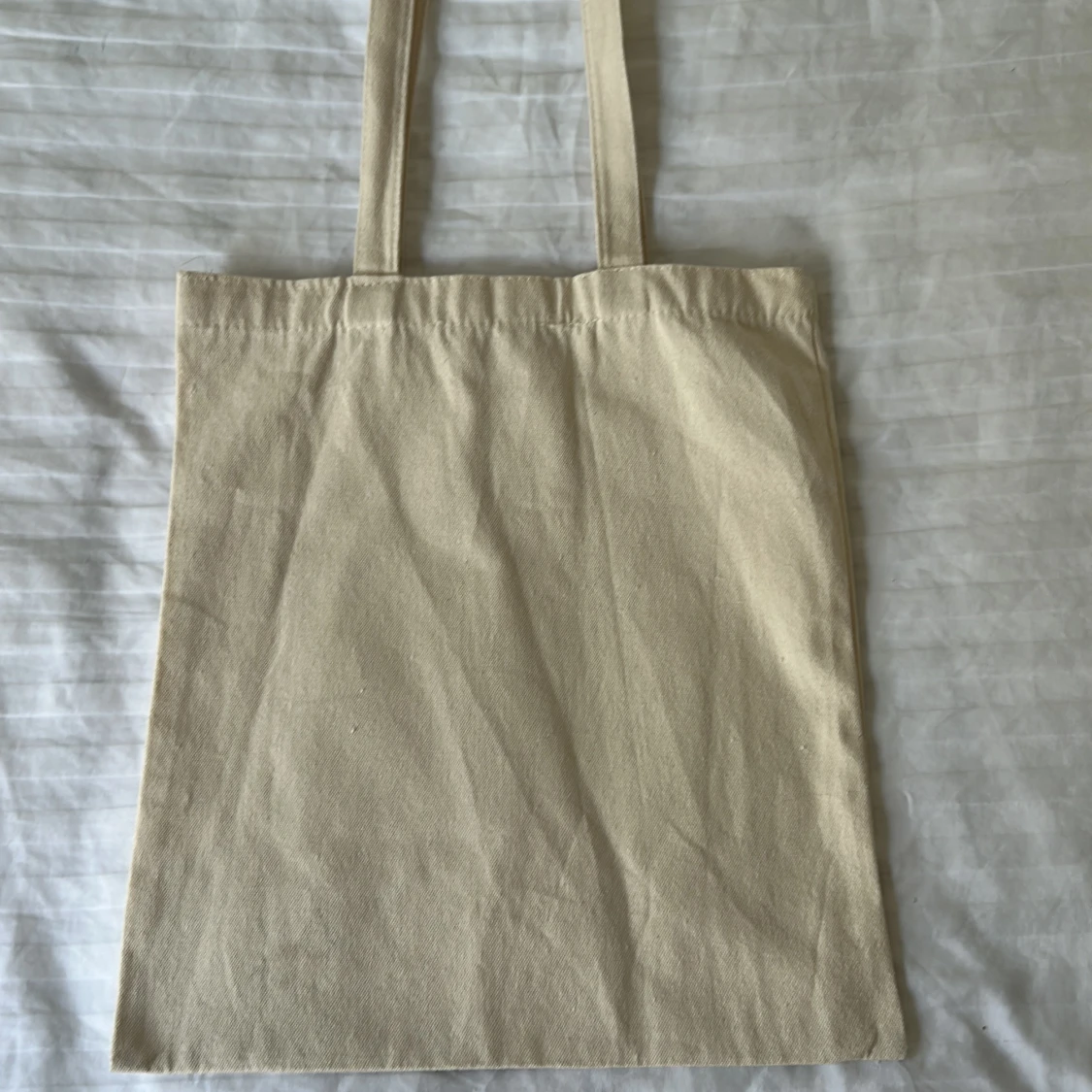 Beige tygkasse med Book Shop-tryck - 1