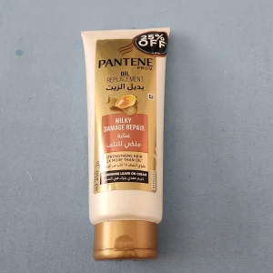 Pantene Pro-V Oil Replacement Milky Damage Repair - Pantene Pro-V Oil Replacement Milky Damage Repair är en närande leave-on kräm för håret. Kommer i en beige och guld tub på 350 ml. Produkten stärker håret 2x mer än olja och är framtagen för att reparera skadat hår.