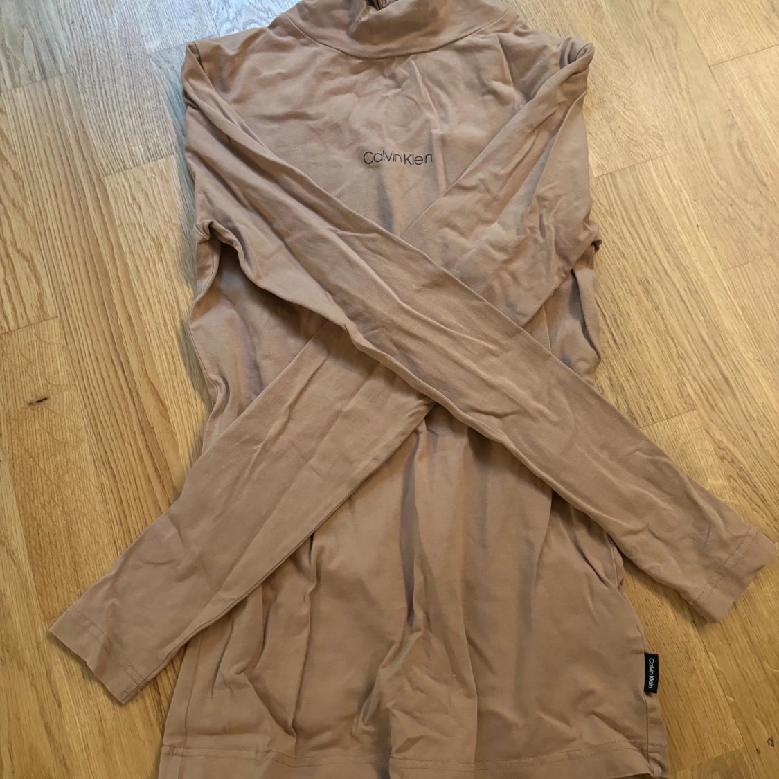 Beige polotröja från Calvin Klein