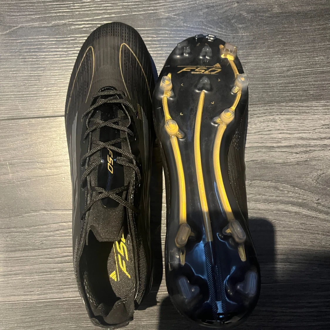 ADIDAS F50 ELITE FG DARK SPARK - SVART/SILVER/GULD