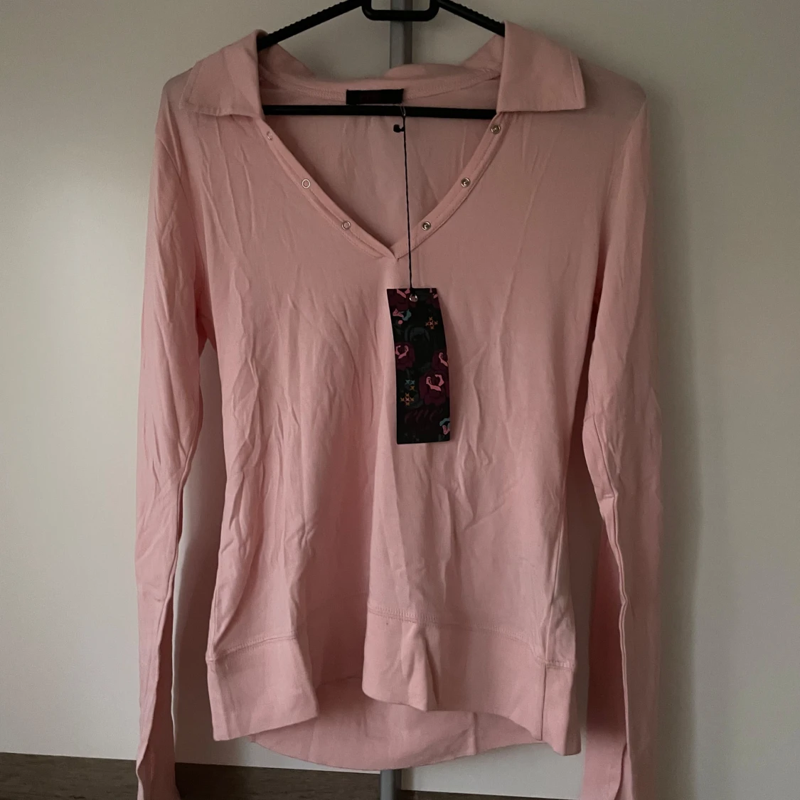 Ljusrosa långärmad pikétröja