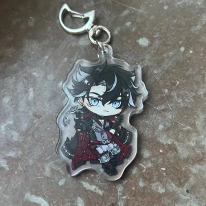Genshin Impact Wriothesley keychain - Keychain of Wriothesley from Genshin Impact! Perfect for your bag decorations or collection :)  (There might be scratches on the surface but that’s only on the protective layer of plastic, peel it off on both sides and it’ll be perfectly shiny!)
