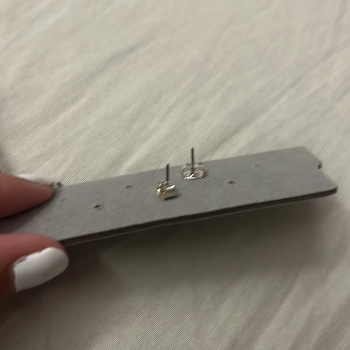 Silvriga stjärnörhängen i miniformat - 1