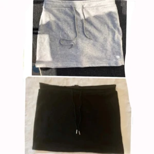 2-pack mjuka kortkjolar  - Två enkla och mjukis kortkjolar i svart och ljusgrått. Båda har ett par shorts inuti själva kjolen. (har lagt ut som enkilt både dem svarta och de gråa oxå) köpte i M men dom va väldigt små i storleken så aldrig använda eller testad