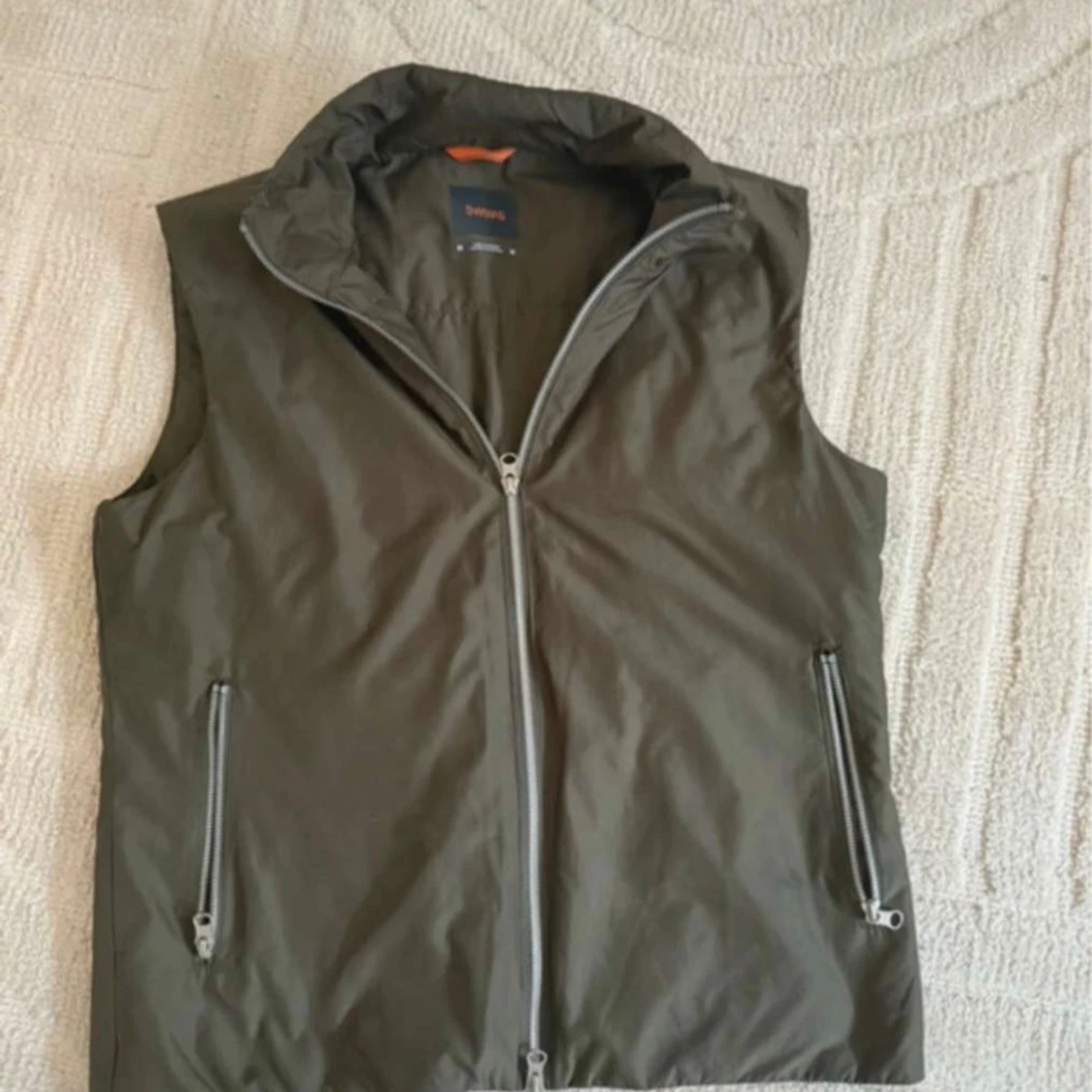 Grön väst från SWIMS