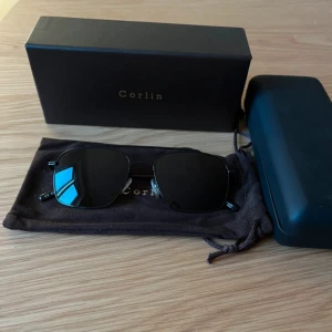 Solglasögon  - Helt nya och oanvända solglasögon från Corlin. 