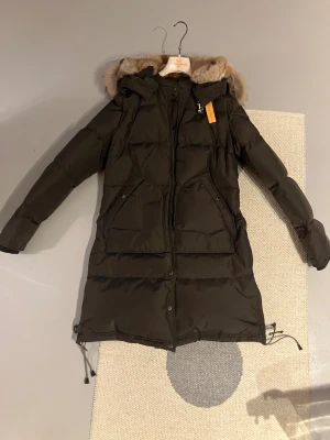 Parajumpers Women's Long Bear Hooded Parka Olive Grey - Newer worn. Wrong buy by my mother. Parajumpers Women's Long Bear Hooded Parka Olive Grey with insulated coat fur. Perfect condition. Sizes is quite small. Will not sell for under asking price.