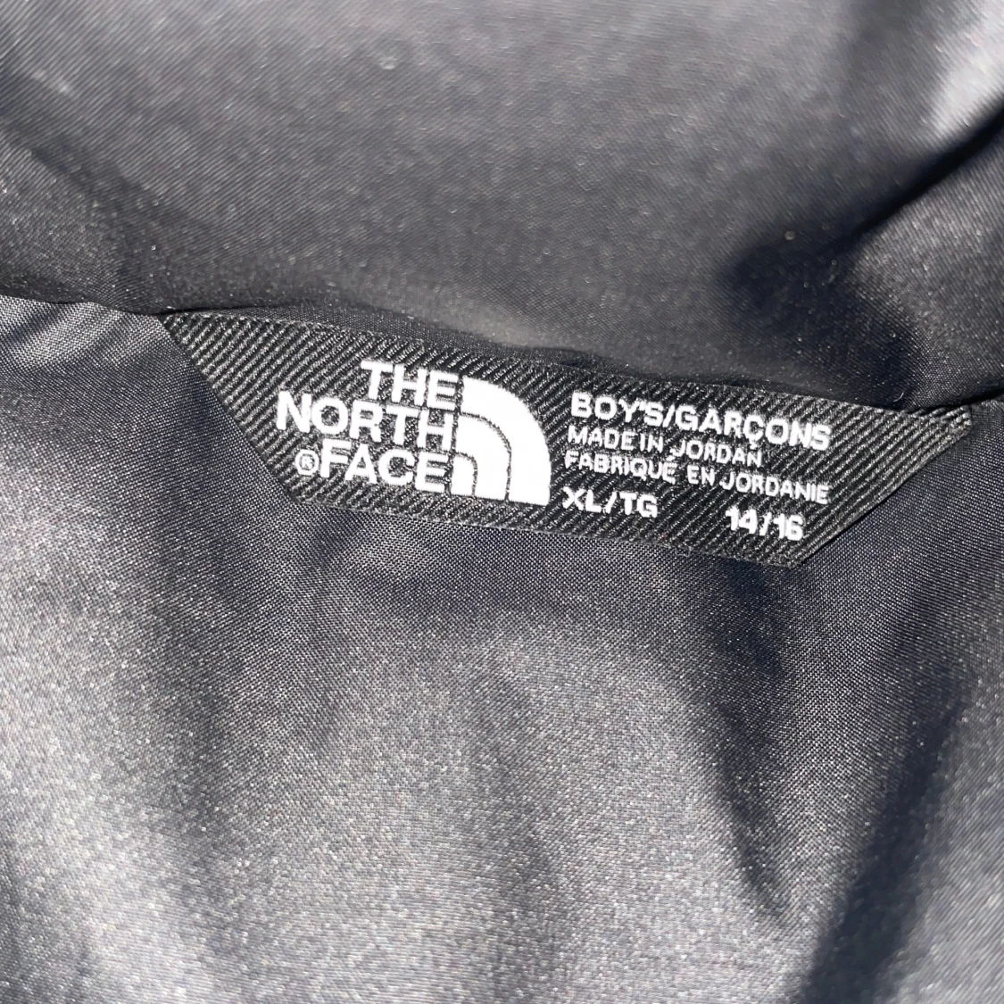 Svart pufferjacka från The North Face (14-16) - 2