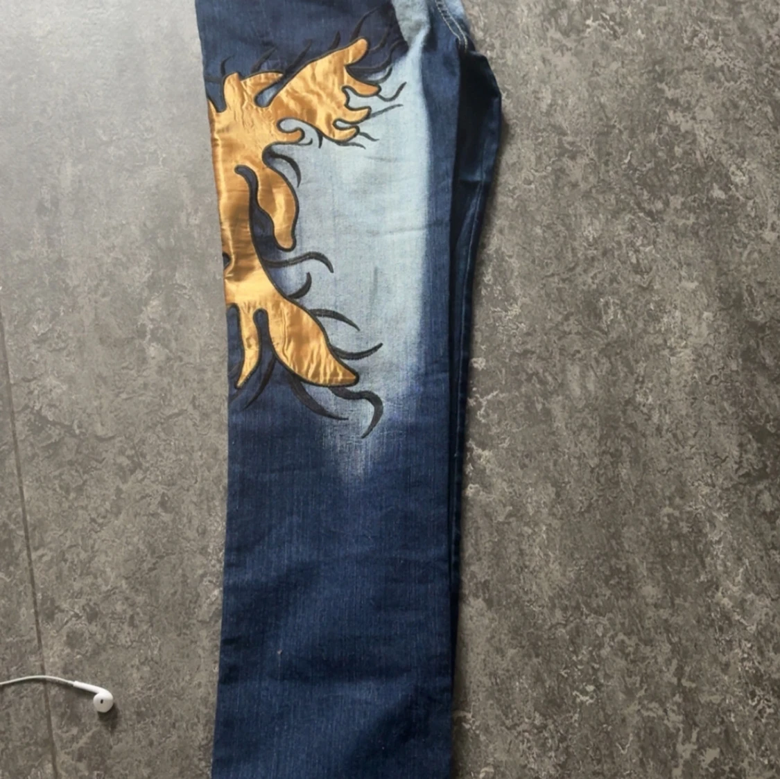 A pair of low waisted printed 2000s jeans S/M - 1