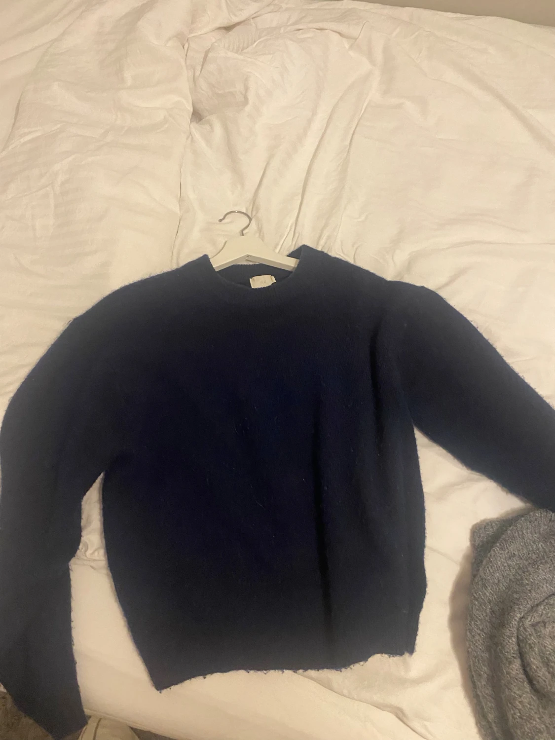 Mörkblå stickad tröja från H&M XS