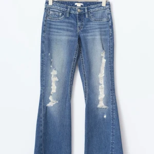 Blå bootcut jeans från Gina Tricot  - Säljer nu mina as snygga jeans ifrån Gina Tricot. De är i storlek 158.  Det är i bra skick.