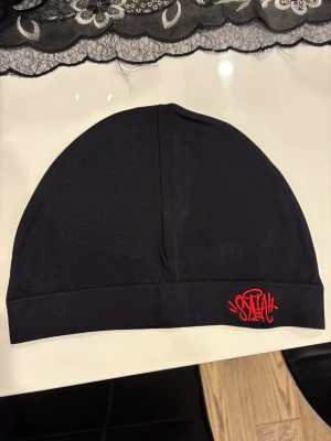 Syna world mössa  - Syna world mössa helt ny