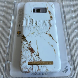 iDeal of Sweden Carrara Gold Case for Galaxy S8 Plus - Elegant Carrara Gold mobilskal för Galaxy S8 Plus från iDeal of Sweden. Slimmad design, lättvikt och svenskt mode. Skalet är nytt i originalförpackning och skyddar din telefon med stil. Passar perfekt och är kompatibelt med iDeal Concept tillbehör.